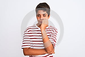 Handsome teenager boy standing over white isolated background looking stressed and nervous with hands on mouth biting nails