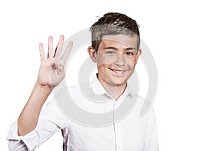 Handsome teenager showing four fingers, number 4 gesture