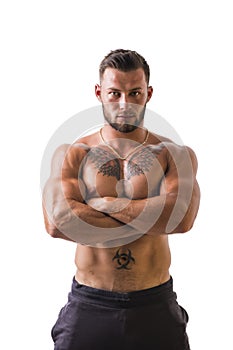 Handsome topless muscular man standing, isolated