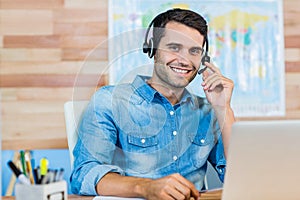 Handsome travel agent smiling at camera