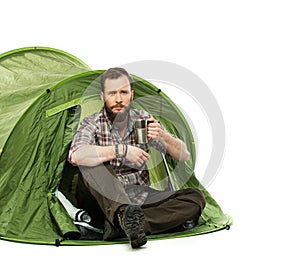 Handsome traveler in a tent