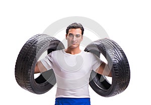 Handsome tyre repairman isolated on white