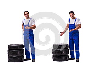 The handsome tyre repairman on white