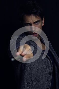 Handsome wizard man holding magic wand