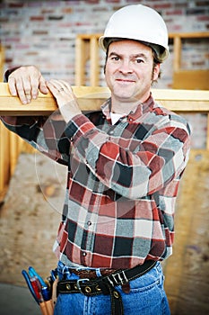 Handsome Worker Carries Lumber