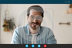 Handsome young 30s man in eyeglasses holding video call.