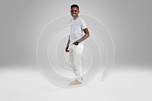 Handsome young african american guy posing in studio - isolated