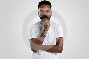 Handsome young african american guy posing in studio - isolated