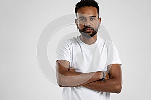 Handsome young african american guy posing in studio - isolated