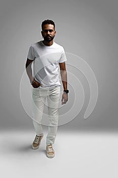 Handsome young african american guy posing in studio - isolated