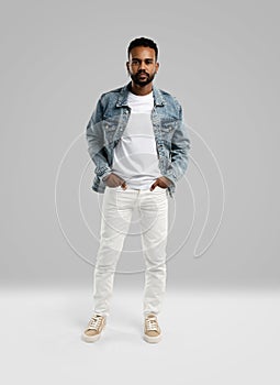 Handsome young african american guy posing in studio - isolated