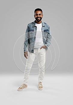 Handsome young african american guy posing in studio - isolated