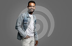 Handsome young african american guy posing in studio - isolated