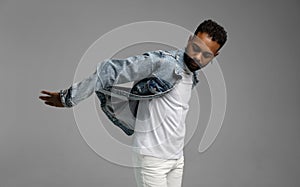 Handsome young african american guy posing in studio - isolated