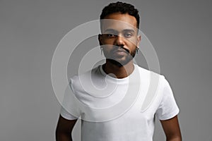 Handsome young african american guy posing in studio - isolated