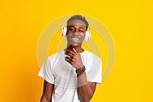 Handsome young african american man listening to music