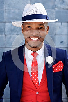 Handsome young african man in suit and hat