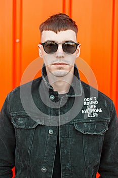 Handsome young American man with a hairstyle in black