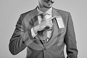 Handsome young arabic businessman with mustache in fashion gray