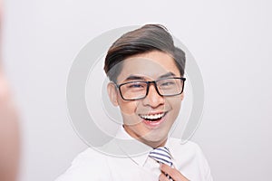 Handsome young asian business man smiling