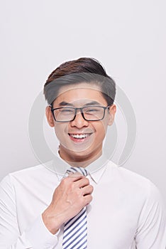 Handsome young asian business man smiling