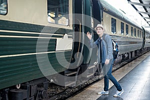 Handsome Young Asian man say goodbye to girlfriend at train stat