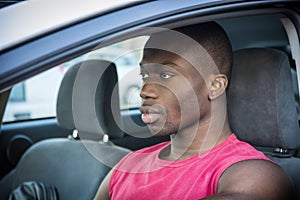 Handsome Young Black Man Driving a Car
