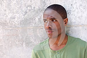 Handsome young black man looking away