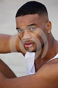 Handsome young black man looking at camera