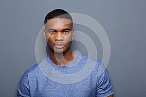 Handsome young black man with serious expression on face