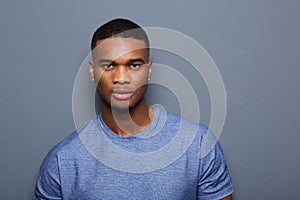 Handsome young black man with serious expression on face photo