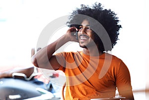 Handsome young black man talking on cell phone