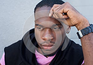 Handsome young black man thinking