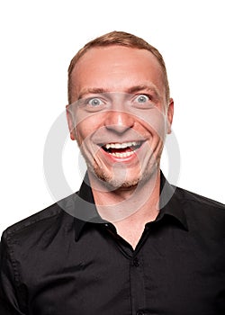 Handsome young blond man in a black shirt, isolated on a white background