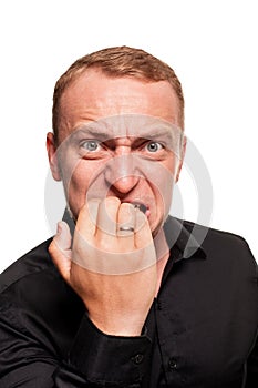 Handsome young blond man in a black shirt, isolated on a white background