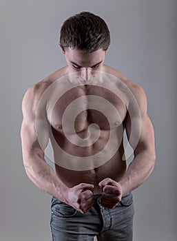 Handsome young bodybuilder posing