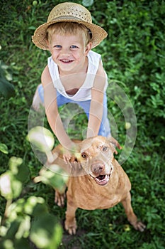 Handsome Young Boy and His Dog looking up