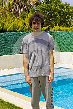 handsome young boy iat the swimming pool in a resort photo