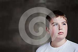 Handsome Young boy looking up with determination