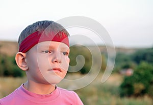 Handsome young boy staring into the distance