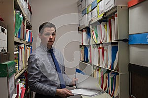 Handsome Young Business Man Searching Files