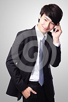 Handsome young business man using cell phone