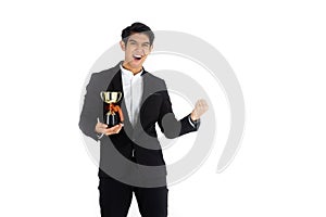 Handsome young businessman Asian caucasian wear a black suit with black hair, be a smile and standing smart poses. Hold a trophy.