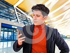 Handsome young businessman talking on cell phone