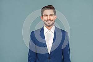 Handsome young businessman toothy smiling