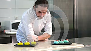 Handsome young chef smiling cheerfully