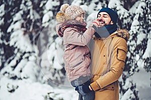 Dad with daughter outdoor in winter