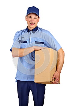 Handsome young delivery man holding box