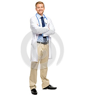 Handsome young doctor posing with his arms folded in studio. Fullbody confident friendly caucasian general practitioner