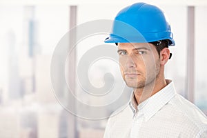Handsome young engineer in hardhat